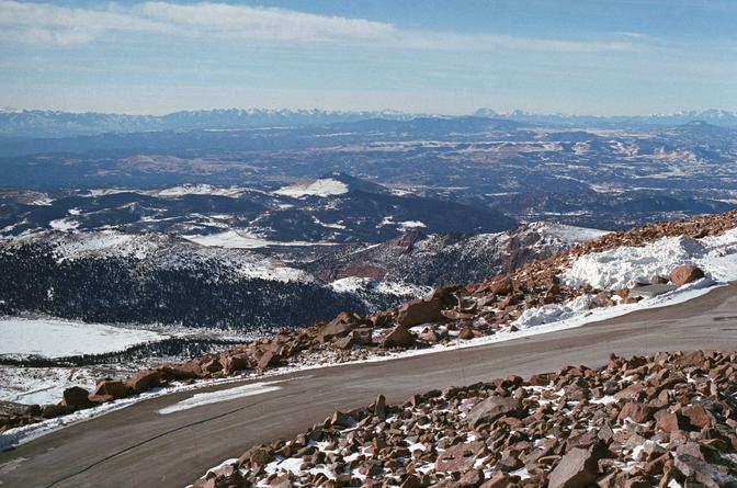 A snowy road leading up Pikes Peak